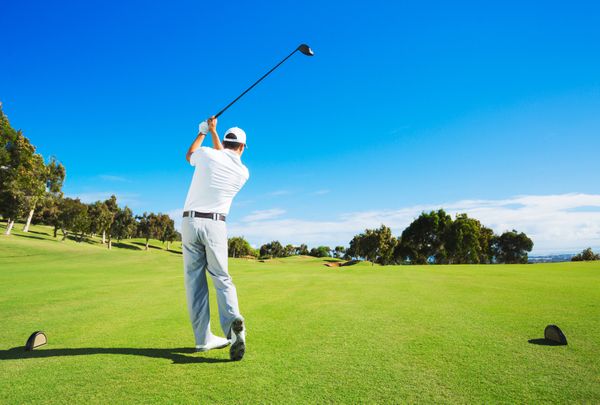 A man swings a golf club Erectile Dysfunction